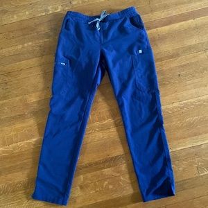 Navy blue Yola Figs scrubs.